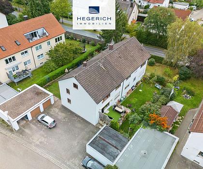 HEGERICH: Kapitalanleger aufgepasst! 4 Wohneinheiten mit Balkonen, Garten und 5 Garagen